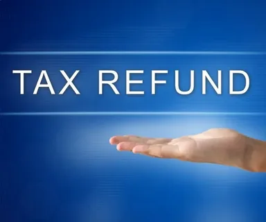 UK construction subcontractor reviewing CIS tax return paperwork and calculator